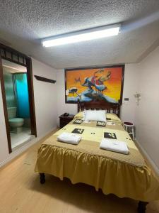 Postel nebo postele na pokoji v ubytování HOTEL El INDIO