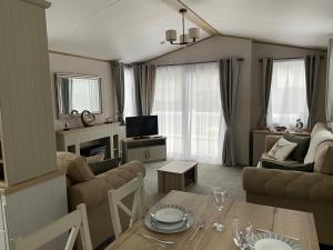 a living room with a table and a couch at The avenue, Waterside in Paignton