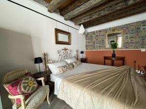 A bed or beds in a room at Arena al Palio