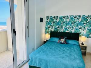Ένα ή περισσότερα κρεβάτια σε δωμάτιο στο Residence Frontemare