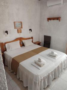 Postel nebo postele na pokoji v ubytování Kissandros Hotel + 37 fotografií