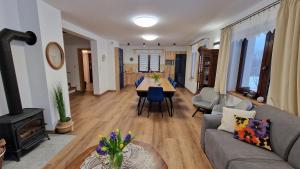 a living room with a couch and a table and a fireplace at Apartamenty U Pana Jana in Wetlina