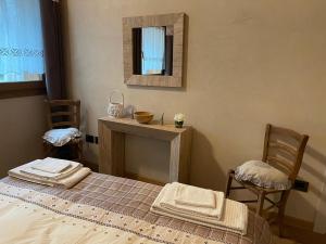 Postel nebo postele na pokoji v ubytování La Corbeille