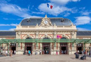 a large building with a flag on top of it at Escale de Nice in Nice