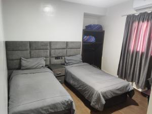Postel nebo postele na pokoji v ubytování Hôtel Saâda