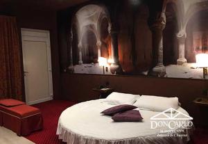 Voodi või voodid majutusasutuse Hotel Don Carlo toas