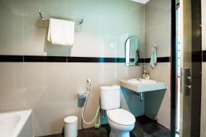 Koupelna v ubytování Super OYO Collection O 3431 Hotel Alpha Bandara