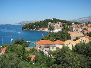 a town on a hill with a body of water at Guesthouse Marija in Cavtat