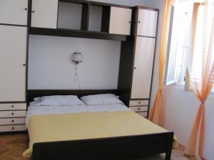 a bedroom with a bed and a bunk bed at Guesthouse Marija in Cavtat