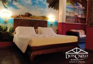 Voodi või voodid majutusasutuse Hotel Don Carlo toas