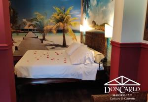 Voodi või voodid majutusasutuse Hotel Don Carlo toas