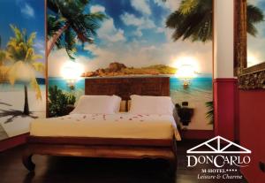 Voodi või voodid majutusasutuse Hotel Don Carlo toas