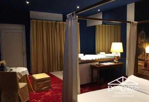 Voodi või voodid majutusasutuse Hotel Don Carlo toas