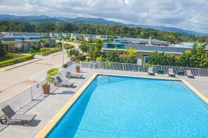 a large swimming pool on top of a building at Beach Holidays at Marina Villa in Saint Annʼs Bay