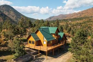 an overhead view of a log cabin in the mountains at Stunning 360° Views - Hiker's Paradise! in Cascade-Chipita Park