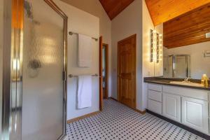 a bathroom with a shower and a sink at Stunning 360° Views - Hiker's Paradise! in Cascade-Chipita Park
