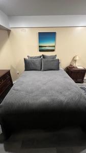 a bedroom with a large bed and a table at The McNeil Mansions in Harrisburg