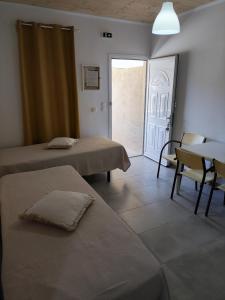 Giường trong phòng chung tại KOUVERTA APARTMENTS