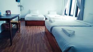 Postel nebo postele na pokoji v ubytování SD View Hotel