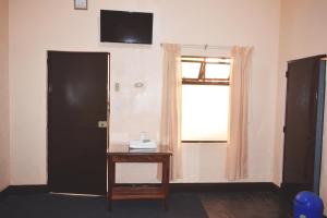 Televisyen dan/atau pusat hiburan di Hotel Realidad