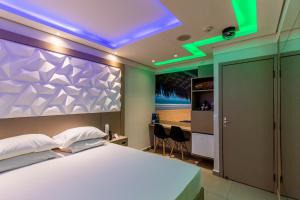 En eller flere senge i et værelse på Motel Veleiros - Zona Norte