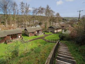 an aerial view of a house with a yard at Chalet Log Cabin C9 in Ilfracombe