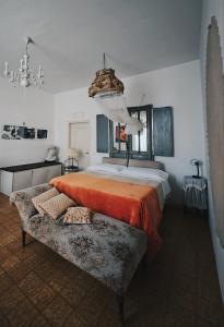 Postel nebo postele na pokoji v ubytování B&B LaMaGia di Corte Moronati