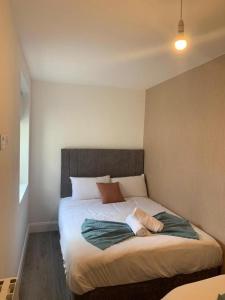 a bedroom with a large bed in a room at Eyre Square Lane Budget Rooms in Galway