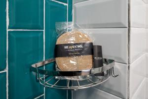 a bag of bread on a shelf in a bathroom at Heaven Inn Airport Hotel in Arnavutköy