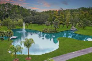 an aerial view of a swimming pool in a park at Cottage in the woods at Emerald Lakes Estate in Saint Augustine