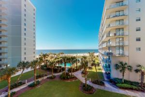 a view of the beach from the balcony of a building at Seaside Beach and Racquet Club Condos II in Orange Beach