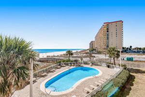 a view of a swimming pool and the beach at Seaside Beach and Racquet Club Condos II in Orange Beach