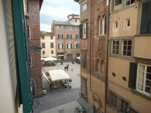 a view of a city street from a building at Dimora Puccini in Lucca
