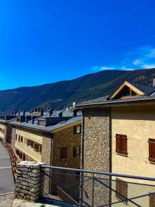 a group of buildings with mountains in the background at Elegante Ático Encamp - FREE Parking Wifi SmartTv - Con altillo y 2 baños completos! in Encamp