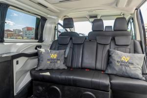 a seat in the back of a van with two pillows at Heaven Inn Airport Hotel in Arnavutköy