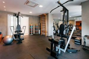 a gym with several exercise equipment in a room at Studio Harmonia, Moderno, Aconchegante e com Garagem in Sao Paulo