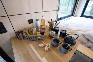 Posteľ alebo postele v izbe v ubytovaní L'Envolée Ecolodge, tiny house au coeur des vignes