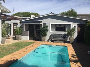 a small swimming pool in front of a house at 43 on Ophir in Cape Town