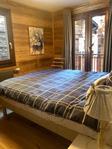 Ένα ή περισσότερα κρεβάτια σε δωμάτιο στο Le Petit Nid