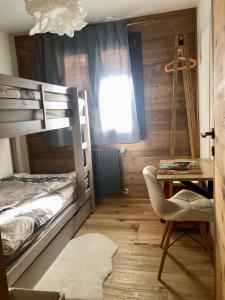 Ένα ή περισσότερα κρεβάτια σε δωμάτιο στο Le Petit Nid