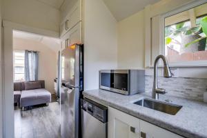 a kitchen with a sink and a refrigerator at OB Beach Daze 2 in San Diego