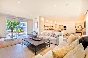 a living room with a couch and a table at Dolphin Sunset in San Diego