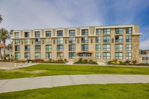 a large building with a lawn in front of it at Beachview Condo in San Diego