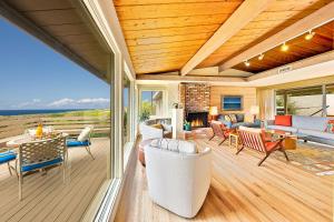 a living room with a view of the ocean at La Jolla Lookout in San Diego