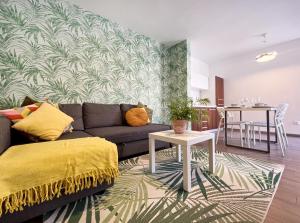 a living room with a couch and a table at Apartments Teodora Maria in Novigrad Istria