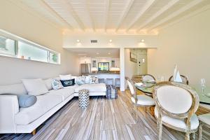 a living room with a couch and a table at On The Beach Casita in San Diego