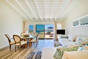 a living room with a couch and a table at On The Beach Casita in San Diego