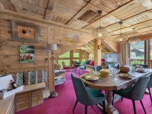 a dining room with a table and chairs at Appartement Saint-Jean-de-Belleville, 4 pièces, 8 personnes - FR-1-570-29 in Saint-Martin-de-Belleville