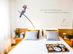 Postel nebo postele na pokoji v ubytování TRYP by Wyndham Leiria