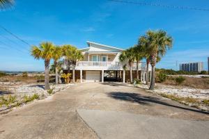 a house on the beach with palm trees at Makarios Beach Blu in Navarre
